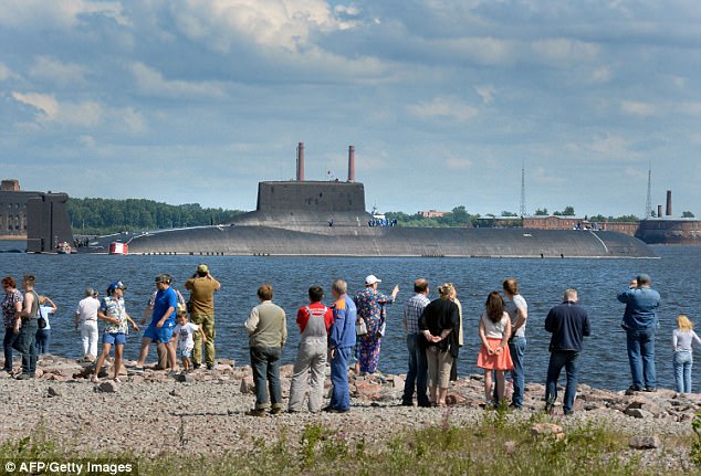 Crowds gathered at the Krondstadt Navy base, near St Petersburg, today, as the huge Dmitry Donskoy submarine arrived ahead of the weekend