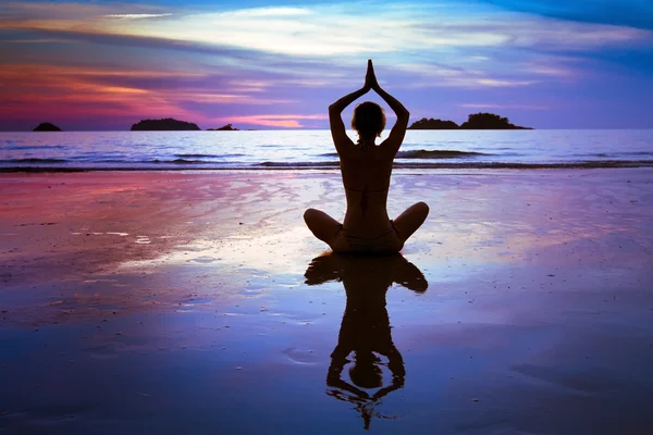 depositphotos 41677639 stock photo yoga on the beach