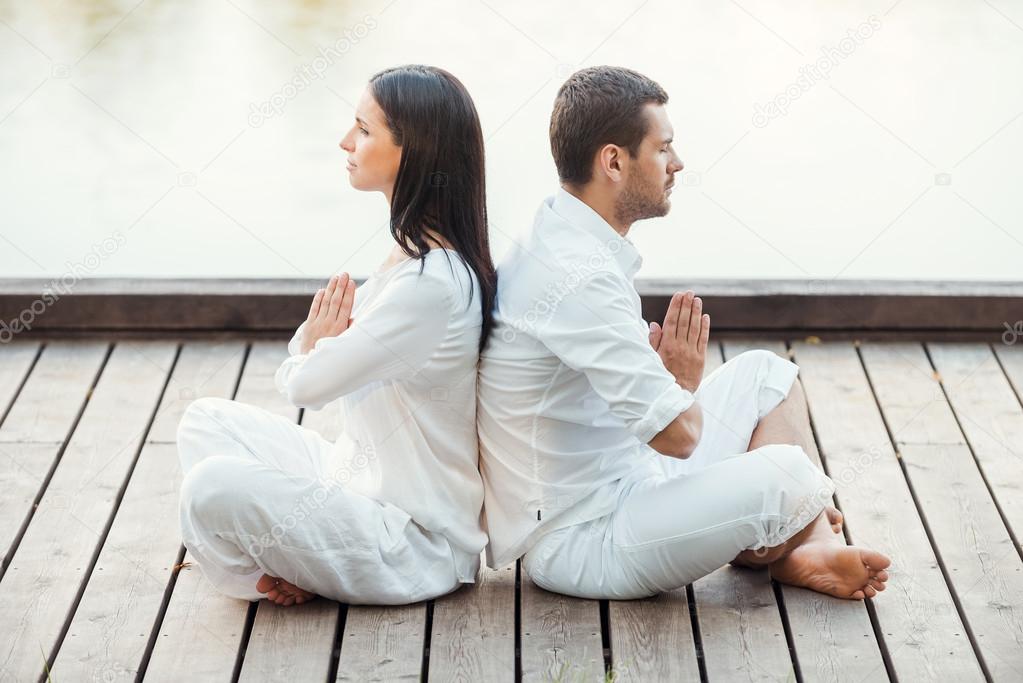 depositphotos 51255375 stock photo couple in white clothing meditating