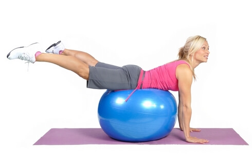 Fit young female pilates instructor showing different exercises